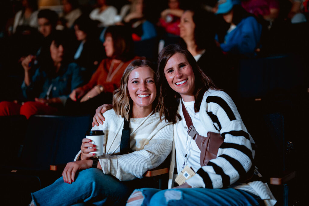 Two women at the Orange Conference today. This image is for the Why Orange Conference is Better When You Bring Someone With You blog.