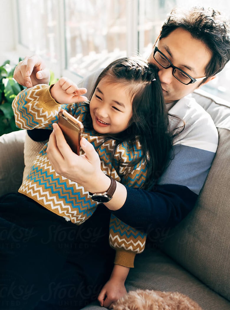 Parent At Home With Their Kid, And The Parent Cue App