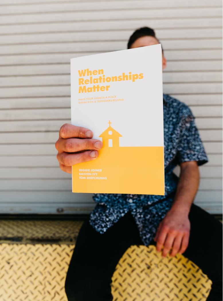 Youth Ministry Leader Holding A Book